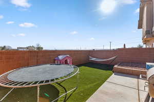 View of yard with a patio