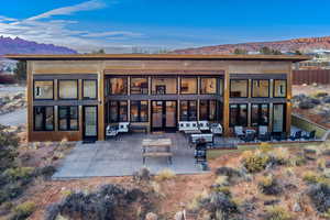 Back of property with a mountain view