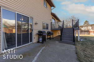 View of patio featuring a grill