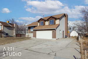 Front facade with a garage and a mountain view