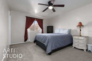 Carpeted bedroom with ceiling fan