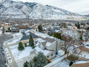 Snowy aerial view with a mountain view