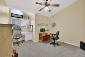 Office with ceiling fan, light colored carpet, and lofted ceiling