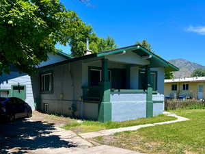 View of front of house featuring a porch and a mountain view