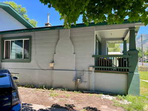 View of side of home with a porch