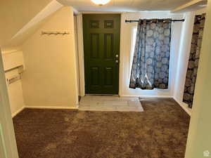 View of carpeted foyer entrance