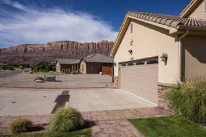 Exterior space with a garage and a mountain view