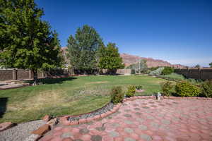 View of yard featuring a mountain view and a patio