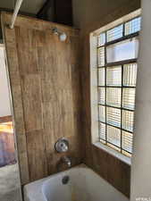 Bathroom featuring tiled shower / bath