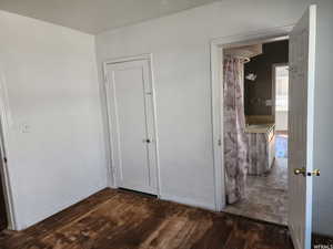 Corridor featuring dark hardwood / wood-style floors