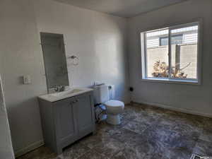 Bathroom with toilet and vanity