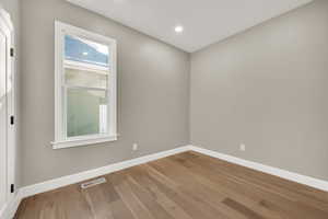 Spare room with light hardwood / wood-style flooring