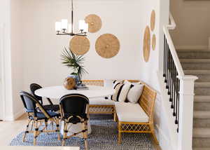 Dining space featuring breakfast area and an inviting chandelier