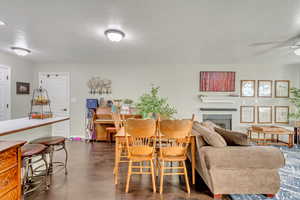 Dining space with ceiling fan and a textured ceiling