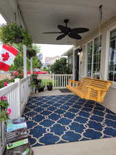 View of patio featuring covered porch and ceiling fan