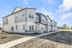 View of front of house with cooling unit