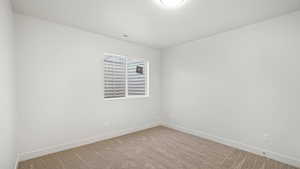 Empty room with carpet flooring