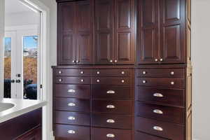 Interior space featuring vanity and french doors