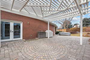 View of patio featuring a jacuzzi, a pergola, a grill, and french doors