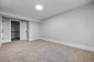 Unfurnished bedroom with carpet flooring and a closet