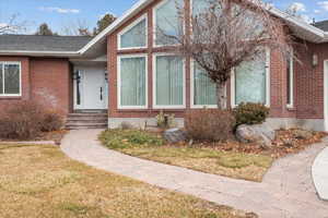 Property entrance featuring a lawn