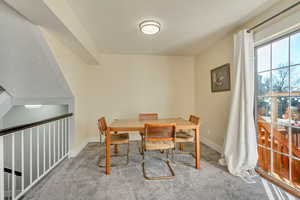 Dining room featuring carpet flooring