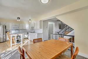 Tiled dining area with sink