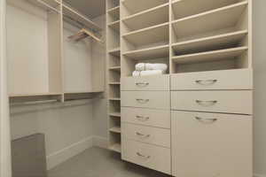 Walk in closet with tile patterned floors