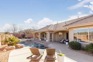 View of pool with a patio area and outdoor lounge area