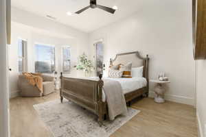 Bedroom with ceiling fan and light hardwood / wood-style floors