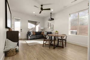 Dining space featuring light wood-type flooring and ceiling fan