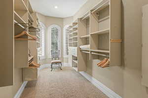 Walk in closet with carpet