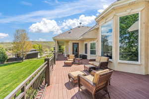 Deck featuring a yard and an outdoor living space