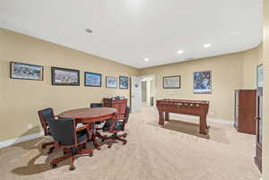 Recreation room featuring light colored carpet