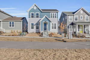 View of front of house with central AC