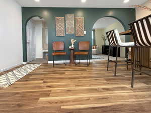 Sitting room with light hardwood / wood-style flooring and a textured ceiling