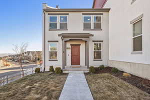 View of front of house with a front yard