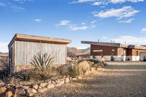 View of outbuilding featuring a mountain view