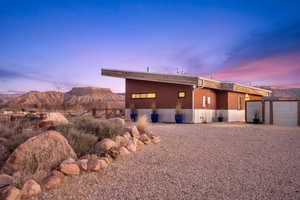 Back house at dusk with a mountain view