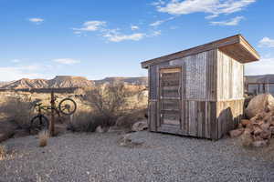 View of outbuilding with a mountain view