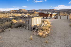 Exterior space featuring a mountain view and an outdoor structure