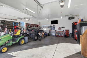 Garage with a workshop area and a garage door opener