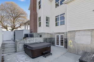 View of patio featuring a hot tub and french doors