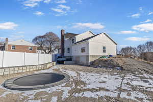 Back of property with a trampoline