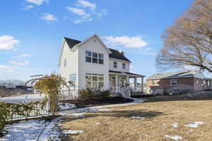 View of property featuring a porch