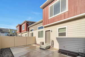 Back of property featuring a patio area and central AC unit