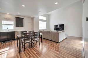 Dining room featuring light hardwood / wood-style floors, sink, and a wealth of natural light