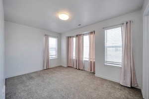 Unfurnished room featuring carpet floors