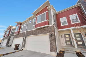 View of property with a garage