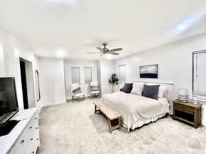 Bedroom featuring ceiling fan and light carpet